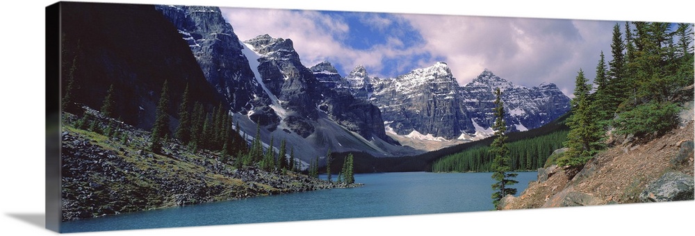 Canada, Alberta, Moraine Lake. Clouds hide the peaks of Moraine Lake in the Valley of the Ten Peaks in Banff NP, a World H...