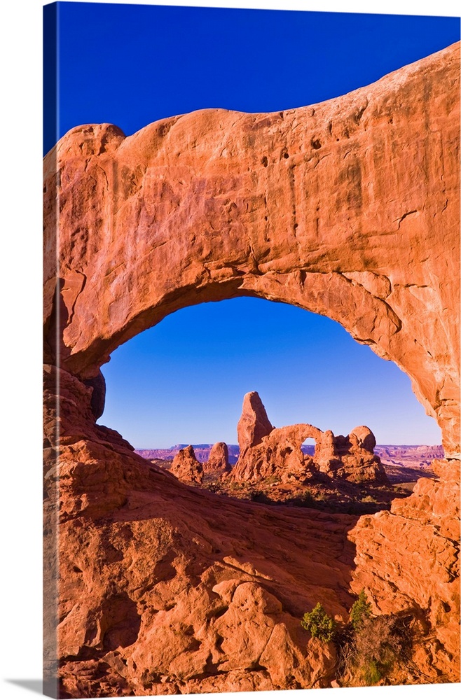 Morning light on Turret Arch through North Window, Arches National Park, Utah USA