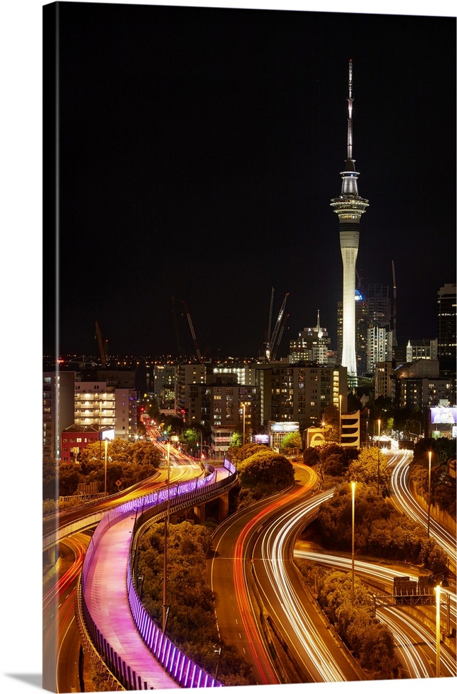 Motorways, Light path cycleway, and sky tower at night, Auckland, North Island, New Zealand.