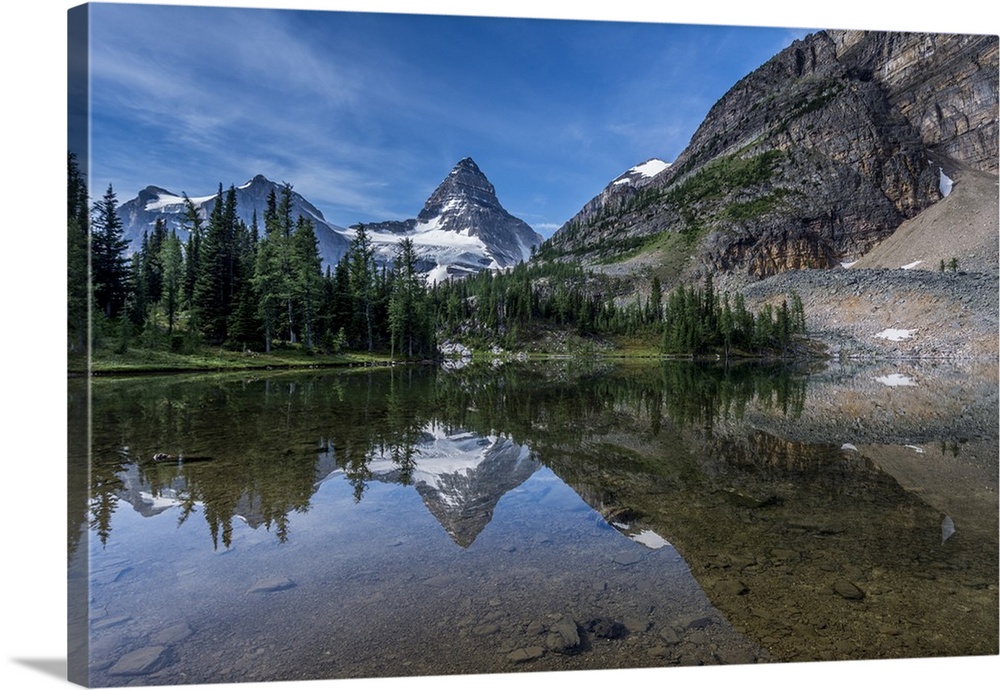 Mount Assiniboine reflected in Sunburst Lake.