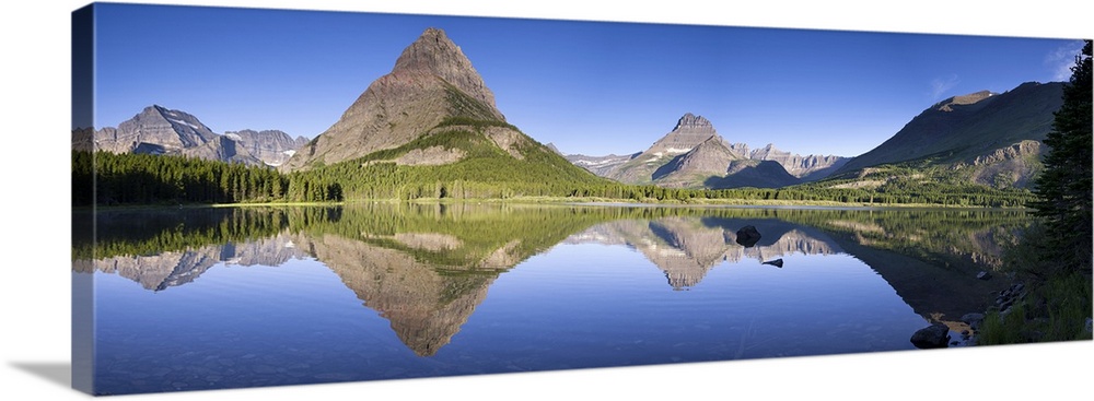 Mountains reflected in Lake. Glacier National Park. Montana. USA.