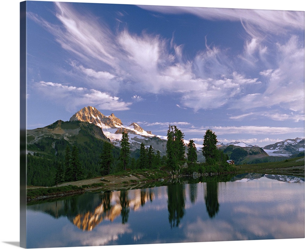 Under a sky of wispy clouds, Mount Garibaldi towers over Elfin Lakes in Mount Garibaldi Provincial Park, British Columbia,...