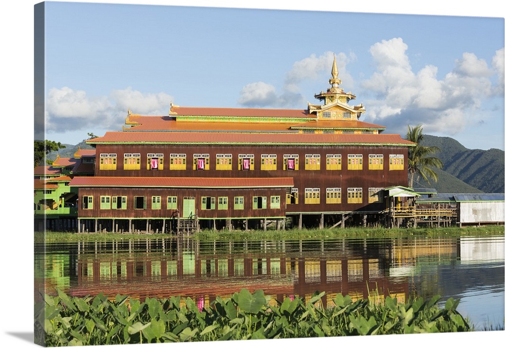 Myanmar, Inle Lake. Nga Phe Chaung Kyaung Monastery reflected in Inle Lake.