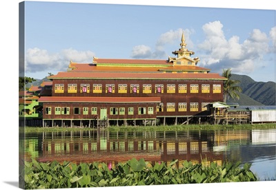 Myanmar, Inle Lake, Nga Phe Chaung Kyaung Monastery reflected in Inle Lake