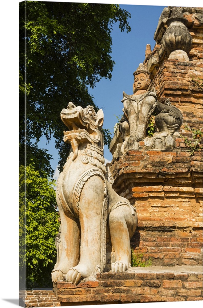 Myanmar. Mandalay. Inwa. Red brick stupa. Lion guardian.