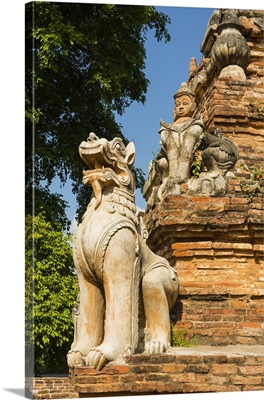 Myanmar, Mandalay, Inwa, Red brick stupa, Lion guardian