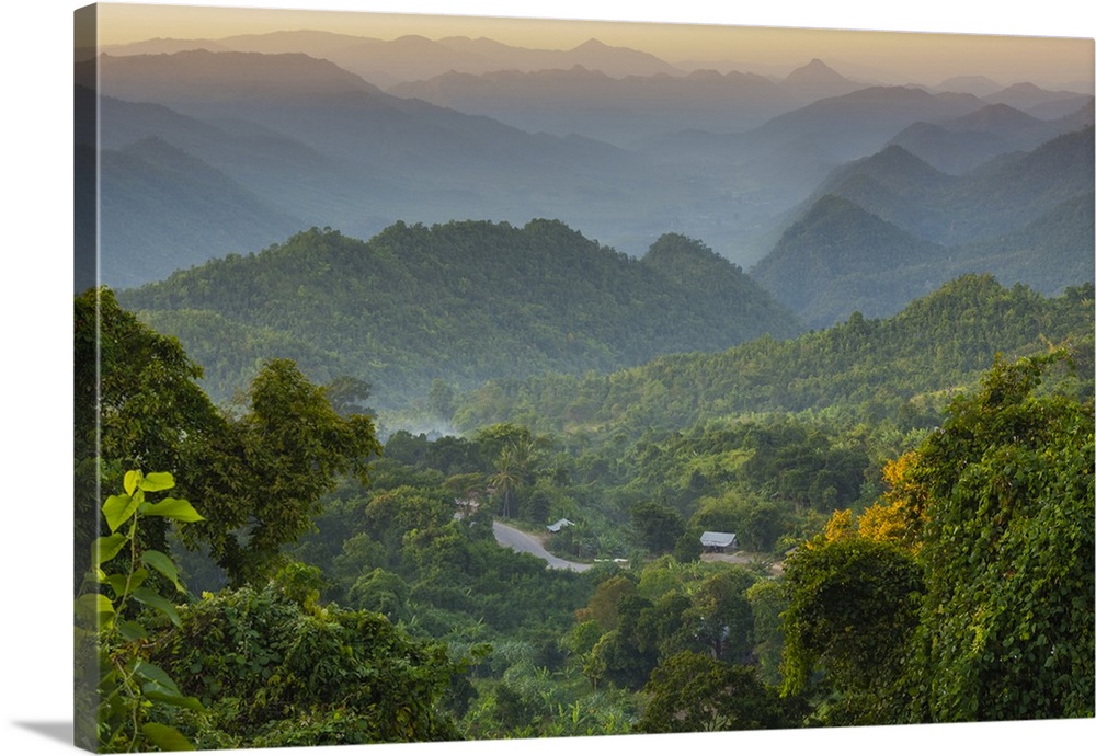 Myanmar. Shan State. Near Kalaw. Sunset over the ridges of haze-filled hills.