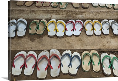 Myanmar, Yangon, Shoes lined up outside a monastery in Yangon