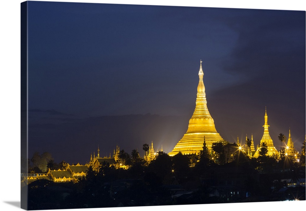 Myanmar, Yangon. Shwedagon Pagoda glows at twilight.