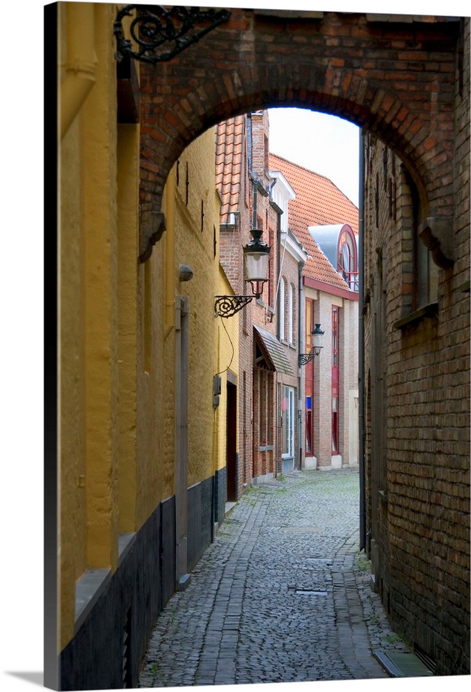Narrow walking street in Bruges in the province of West Flanders, Belgium.