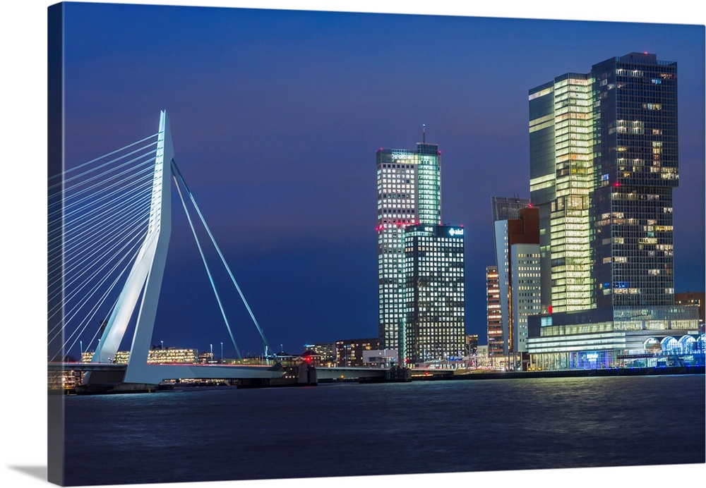 Netherlands, Rotterdam, Erasmusbrug bridge and new commerical towers at the renovated docklands, dusk.