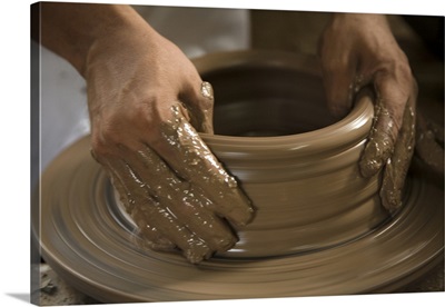 Nicaragua, Catarina, Potter's hands creating clay pottery on spinning wheel