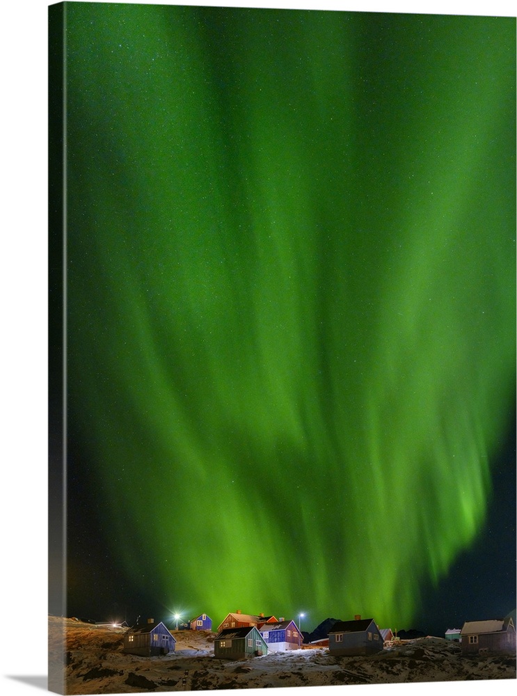 Northern Lights over the town. Town Tasiilaq (formerly called Ammassalik), Kingdom of Denmark.