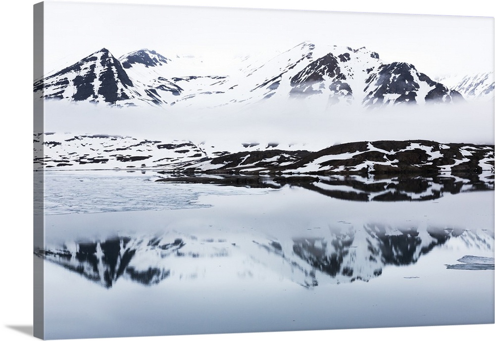Norway, Svalbard, Monacobreen glacier, Reflections of mountains and glacier.