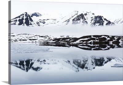 Norway, Svalbard, Monacobreen glacier, Reflections of mountains and glacier