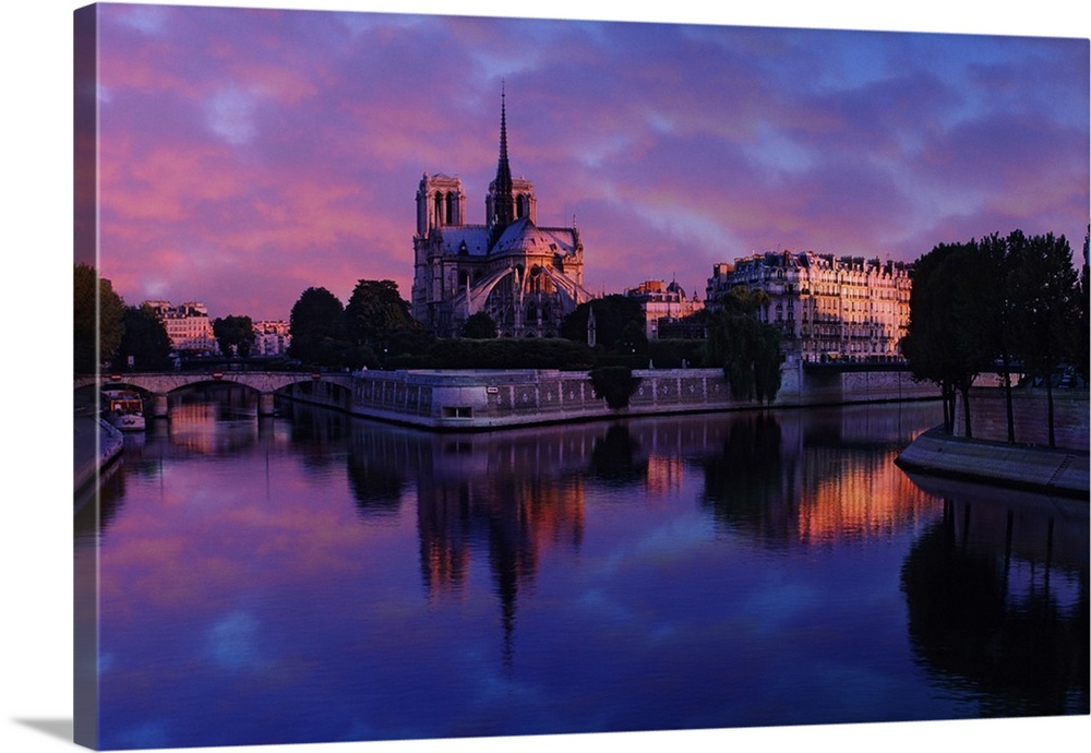 Notre Dame reflected on Seine River at sunrise, Paris, France
