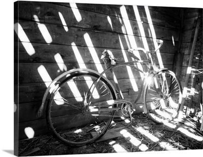 Old Bicycle Inside Barn With Shadows Streaming