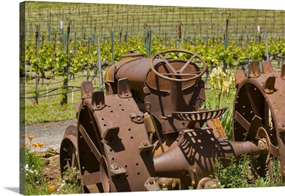 Old rusty iron tractor at Vino Naceto Winery, near Plymouth, Amador county, California