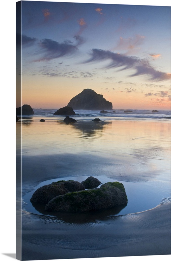 USA, Oregon, Bandon Beach. Face Rock at twilight on the coastline.