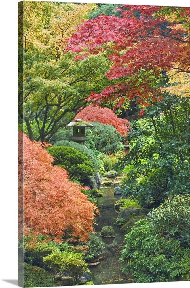 USA, Oregon, Portland. Stone tower and pond in Portland Japanese Garden.
