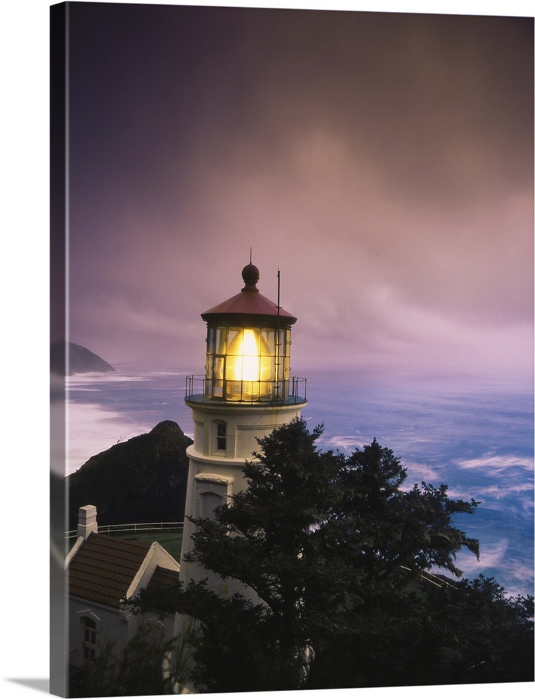 Oregon, View of Heceta Head Lighthouse at dusk.