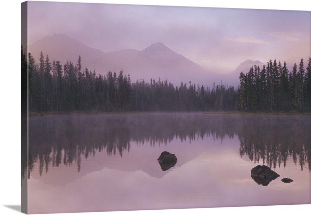 USA, Oregon, Willamette National Forest. Foggy sunrise on Scott Lake and Three Sisters mountains.