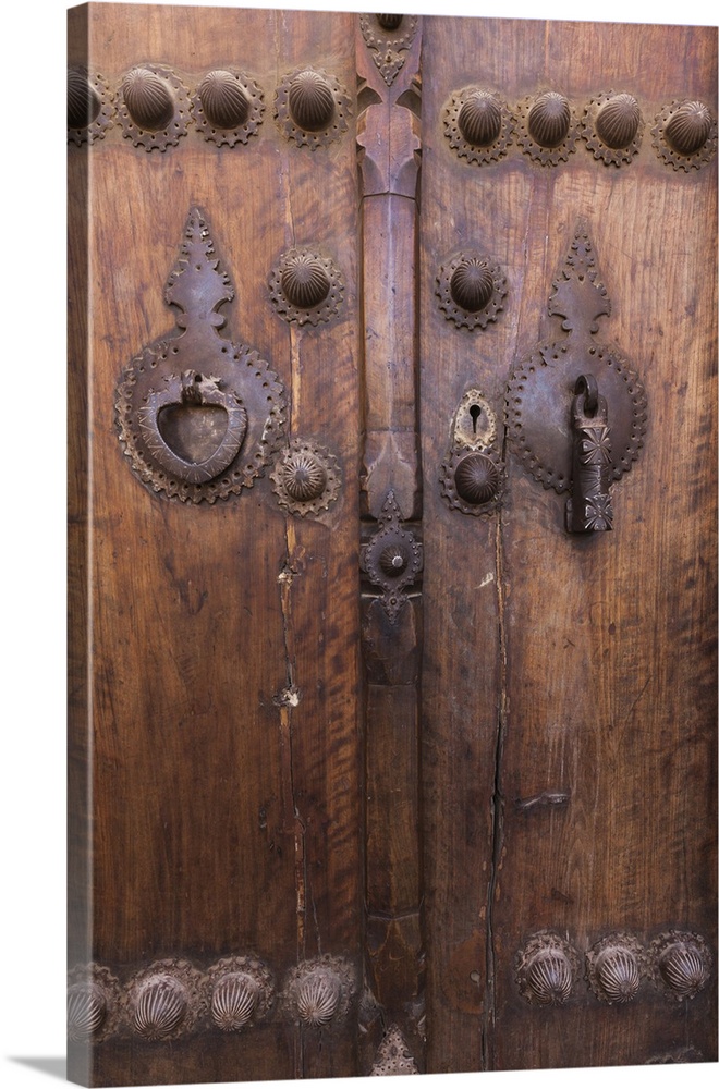 Iran, Central Iran, Kashan, Khan-e Boroujerdi, traditional carpet merchant's house, ornate door with door knockers for mal...