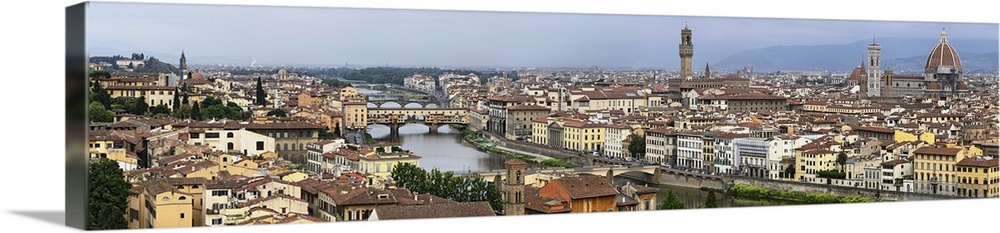Panoramic view of Florence, Italy along the Arno River amd Ponte Vecchio (Old Bridge).