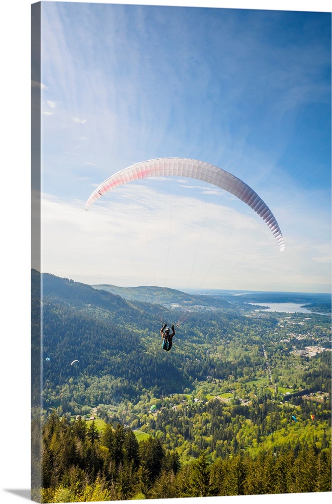 United States, Washington, Issaquah. Paragliders launch from Tiger Mountain and soar westward towards Issaquah.
