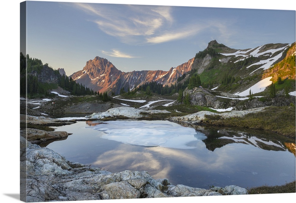 Partially thawed tarn, Yellow Aster Butte Basin. American Border Peak and Yellow Aster Butte are in the distance. Mount Ba...