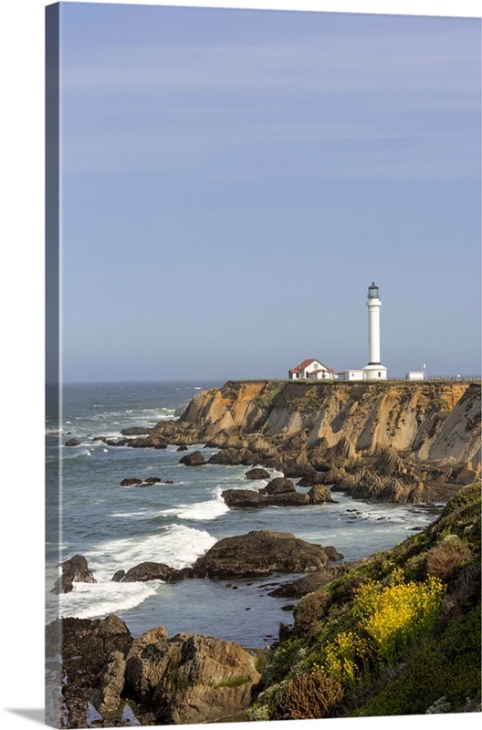 Point Arena lighthouse on cliffs over the Pacific Ocean near Point
