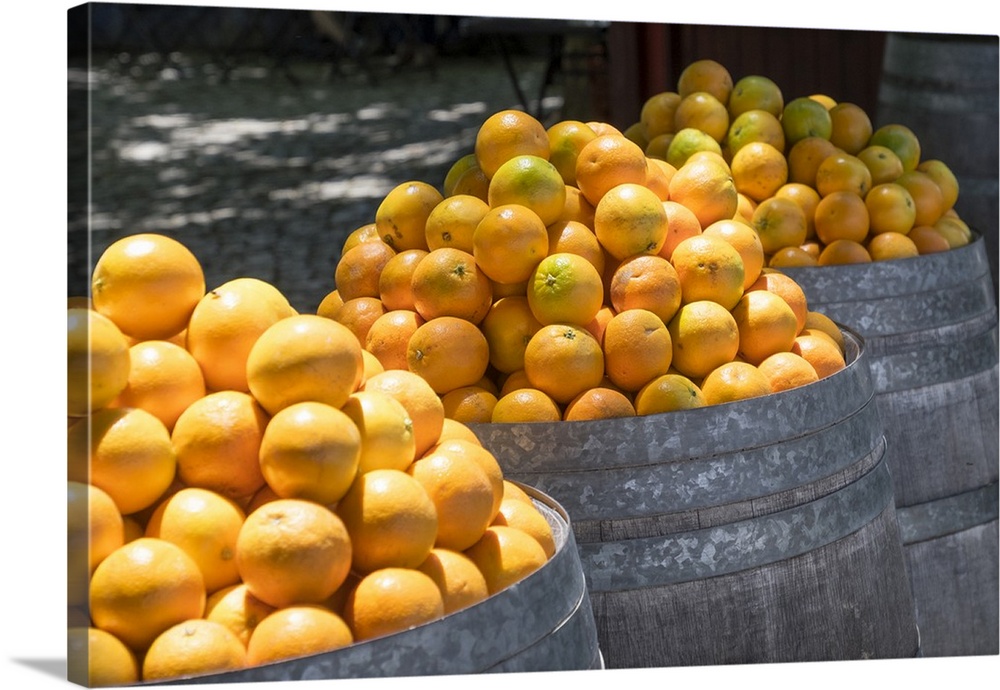 Portugal, Obidos. Barrels of Navel oranges for sale.