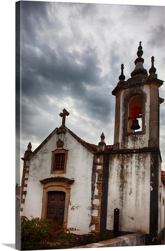 Portugal, Obidos, Igreja de Sao Pedro Church, Obidos with clouds above.