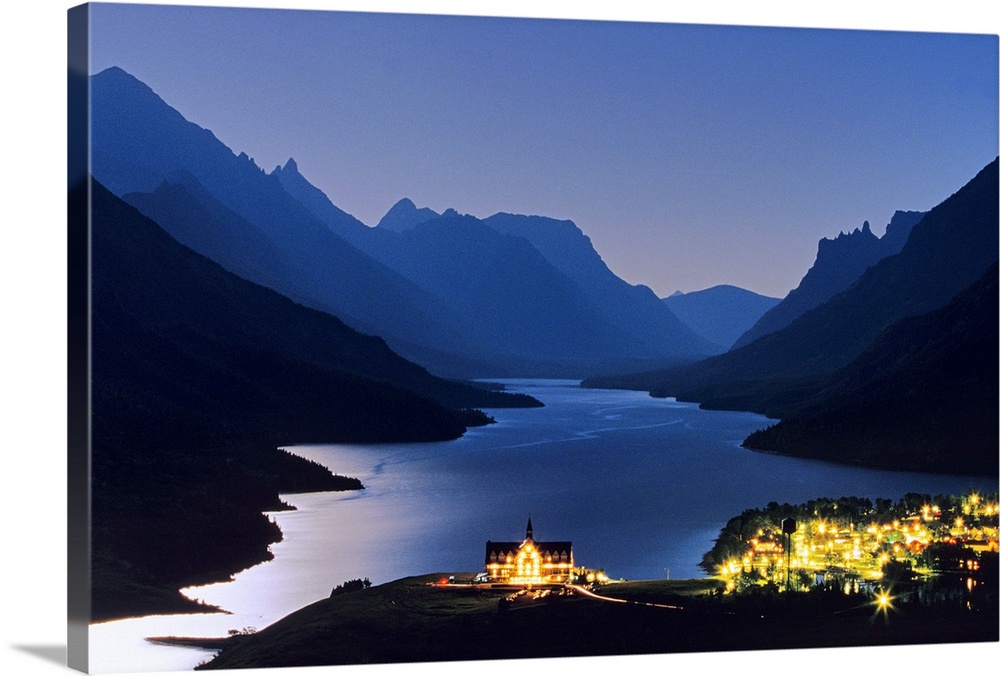 Prince of Wales Hotel and townsite in Waterton Lakes National Park in Alberta Canada under full moonlight
