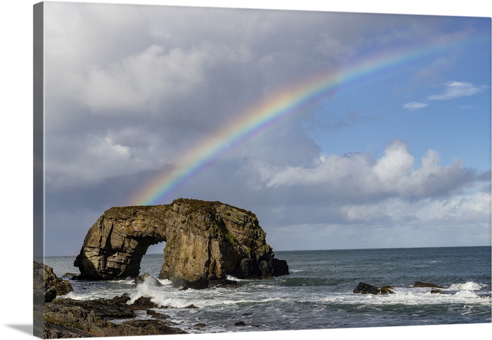Rainbow over The Great Pollet Sea Arch in County Donegal, Ireland.