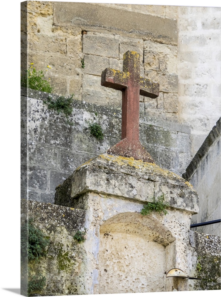 Red stone cross in the old town of Matera.