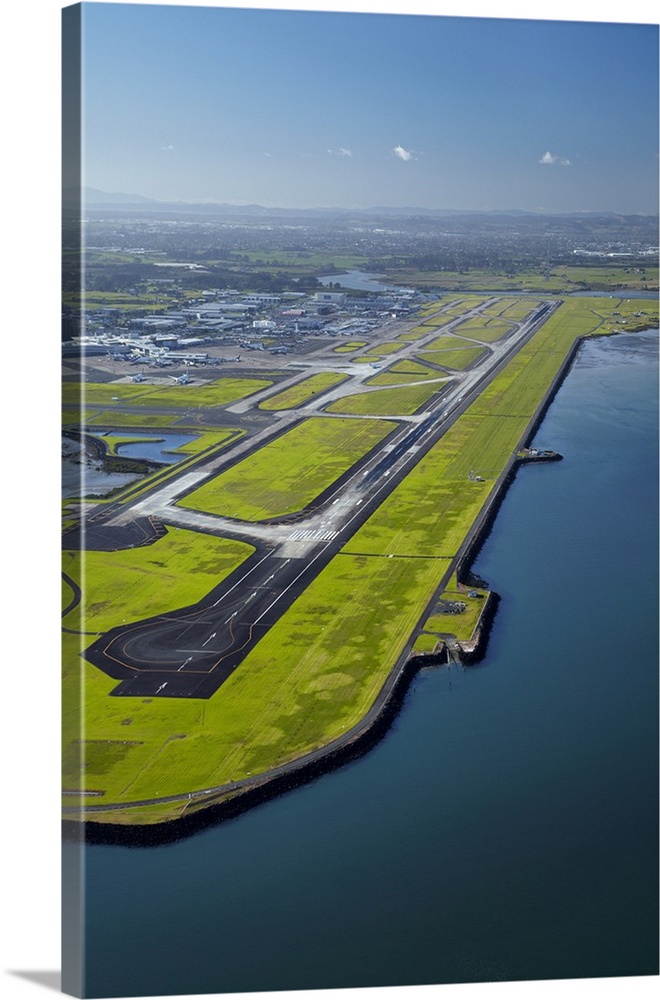 Runway at Auckland Airport, and Manukau Harbour, North Island, New Zealand.