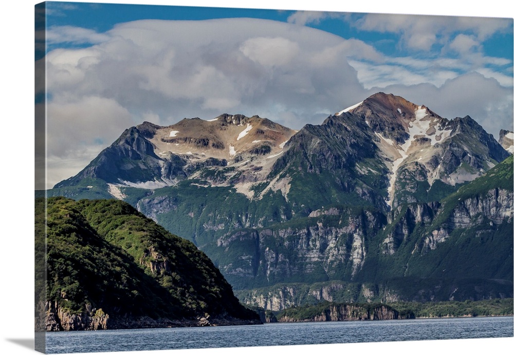 North America, USA, Alaska, Katmai National Park. Scenic landscape in Amalik Bay illustrating snow fields and tan volcanic...