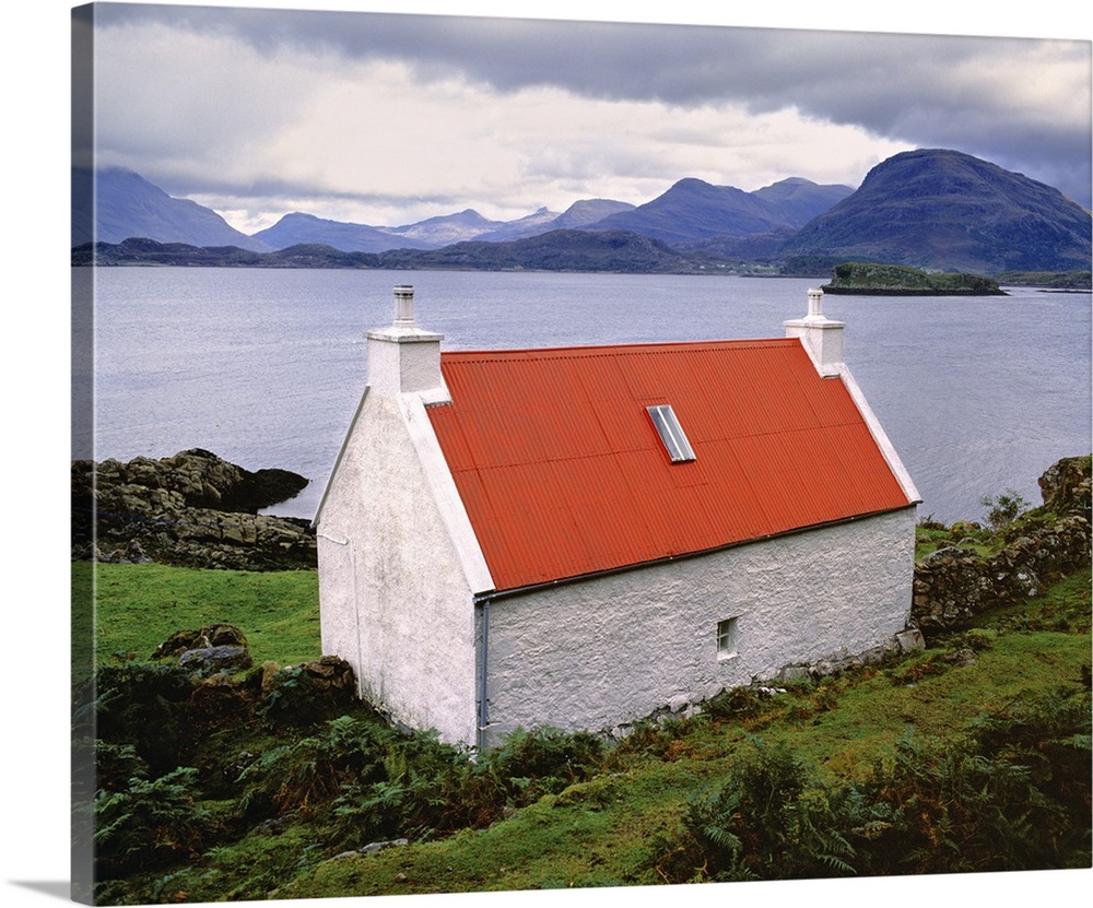 Scotland, Highland, Wester Ross, Applecross. Red-roofed home near Applecross faces the Inner Sound in the Highland, Scotland.