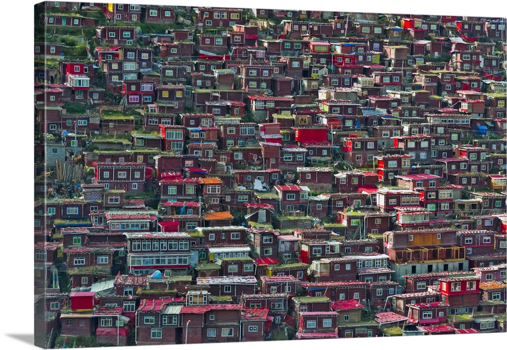 Red log cabins lived by nuns and monks covering the mountain side, Seda Larung Wuming, the world's largest Tibetan Buddhis...