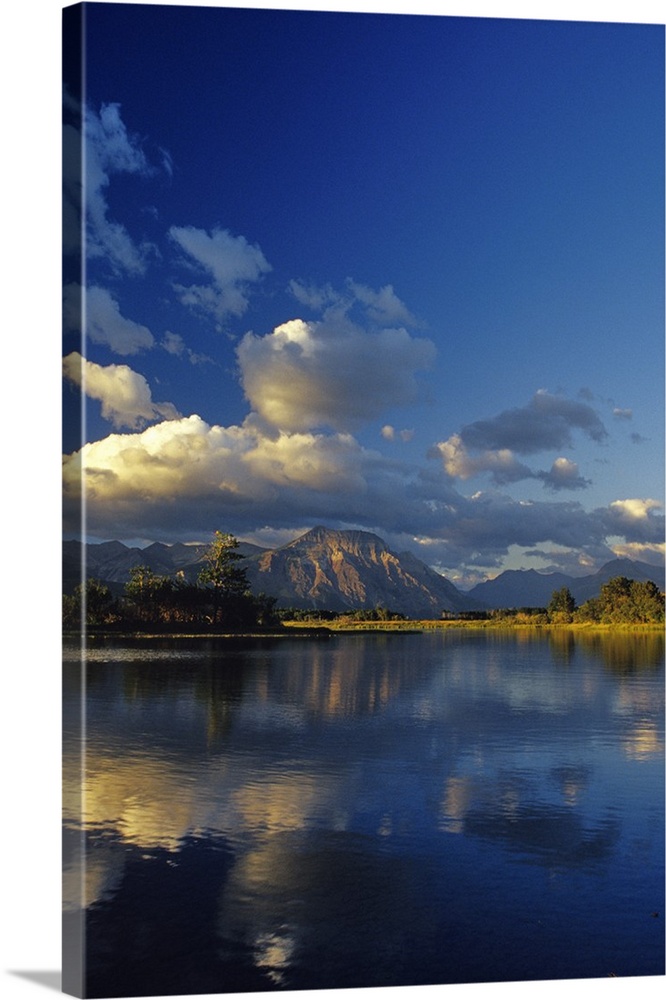 Sofa Mountain reflects into Maskinonge Lake in Waterton Lakes National Park in Alberta Canada