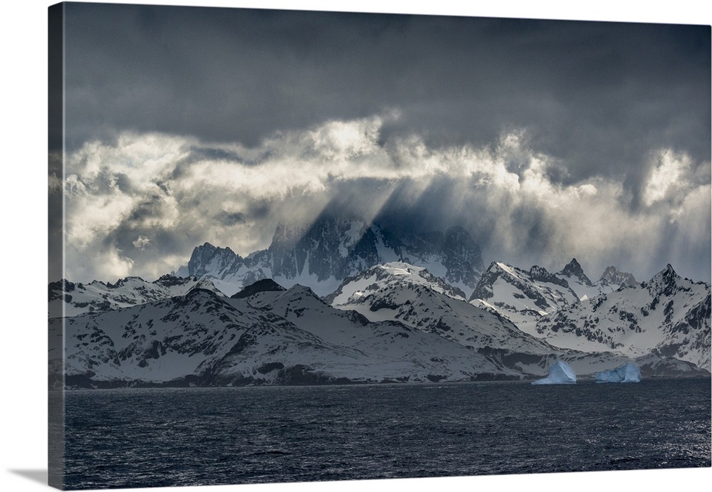South Georgia Island. Opening in clouds and Virga reveal the mountainous and glaciated landscape.