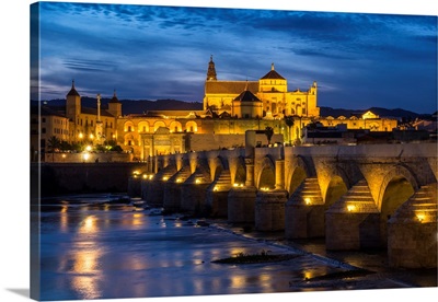 Spain, Andalusia. Cordoba, The Roman Bridge Across The Guadalquivir River At Dusk