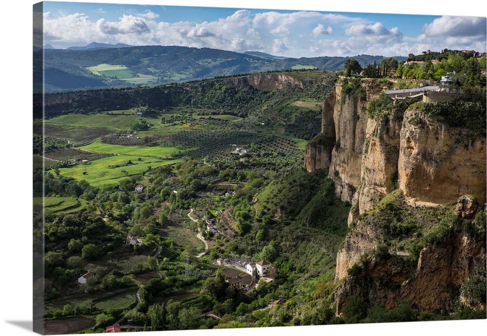 Spain, Andalusia. View over the Ronda Depression, a sloping plateu below the steep limestone cliffs of the hilltown of Ronda.