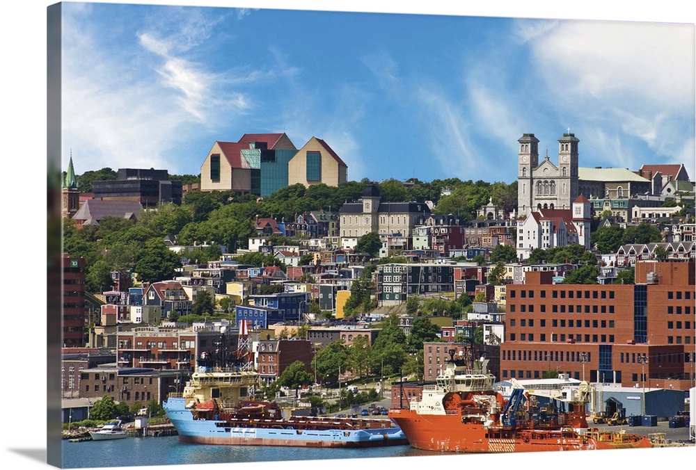 St. John..s, Newfoundland, Canada, the coastline of traditional "Jelly Bean" houses are dominated by The Rooms Provincial ...