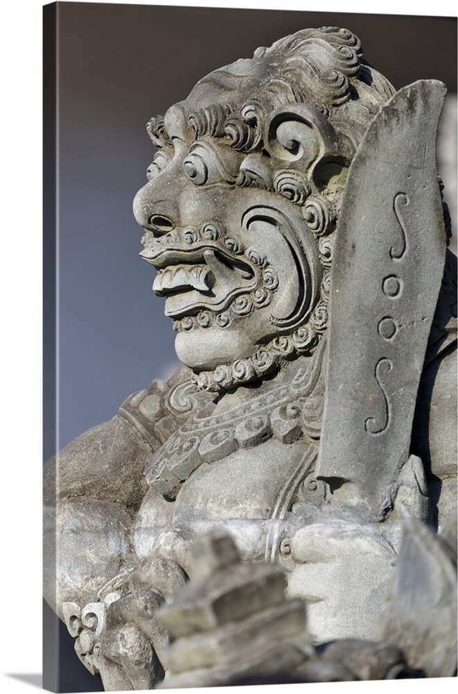 Stone statue at entrance of Tanah Lot. Bali island, Indonesia.