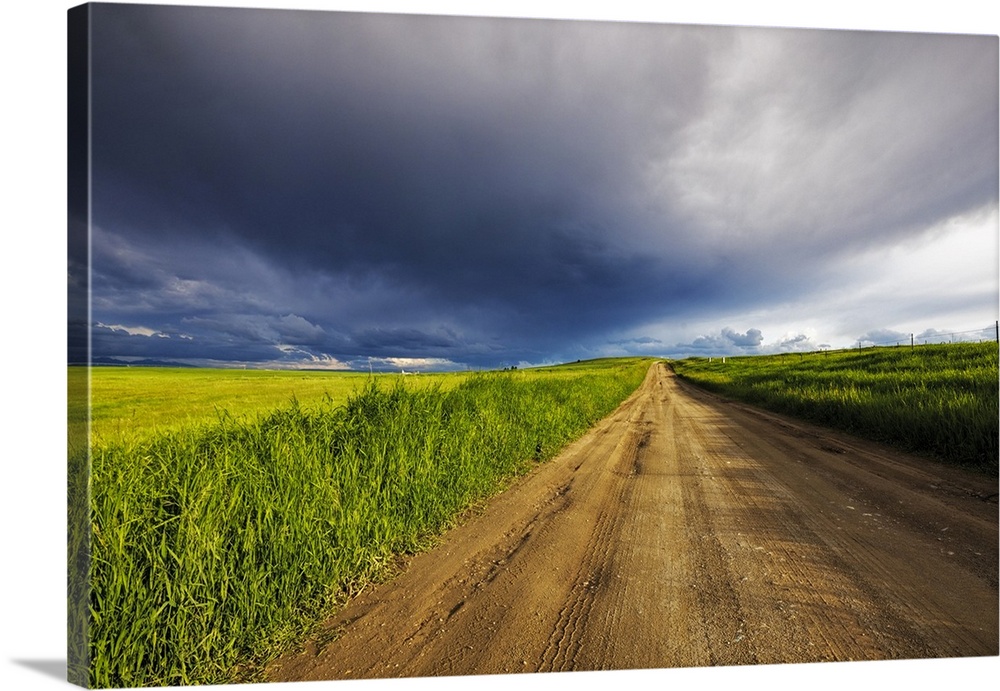 Storm clouds over West Spring Creek Road in the Flathead Valley, Montana, USA.