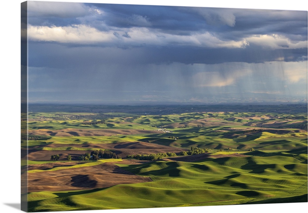 Stormy clouds over rolling hills from Steptoe Butte near Colfax, Washington State, USA.