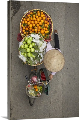 Street Vendor With Round Baskets Of Fruit On Bicycle, Old Quarter, Hanoi, Vietnam