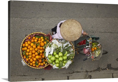 Street Vendor With Round Baskets Of Fruit On Bicycle, Old Quarter, Hanoi, Vietnam